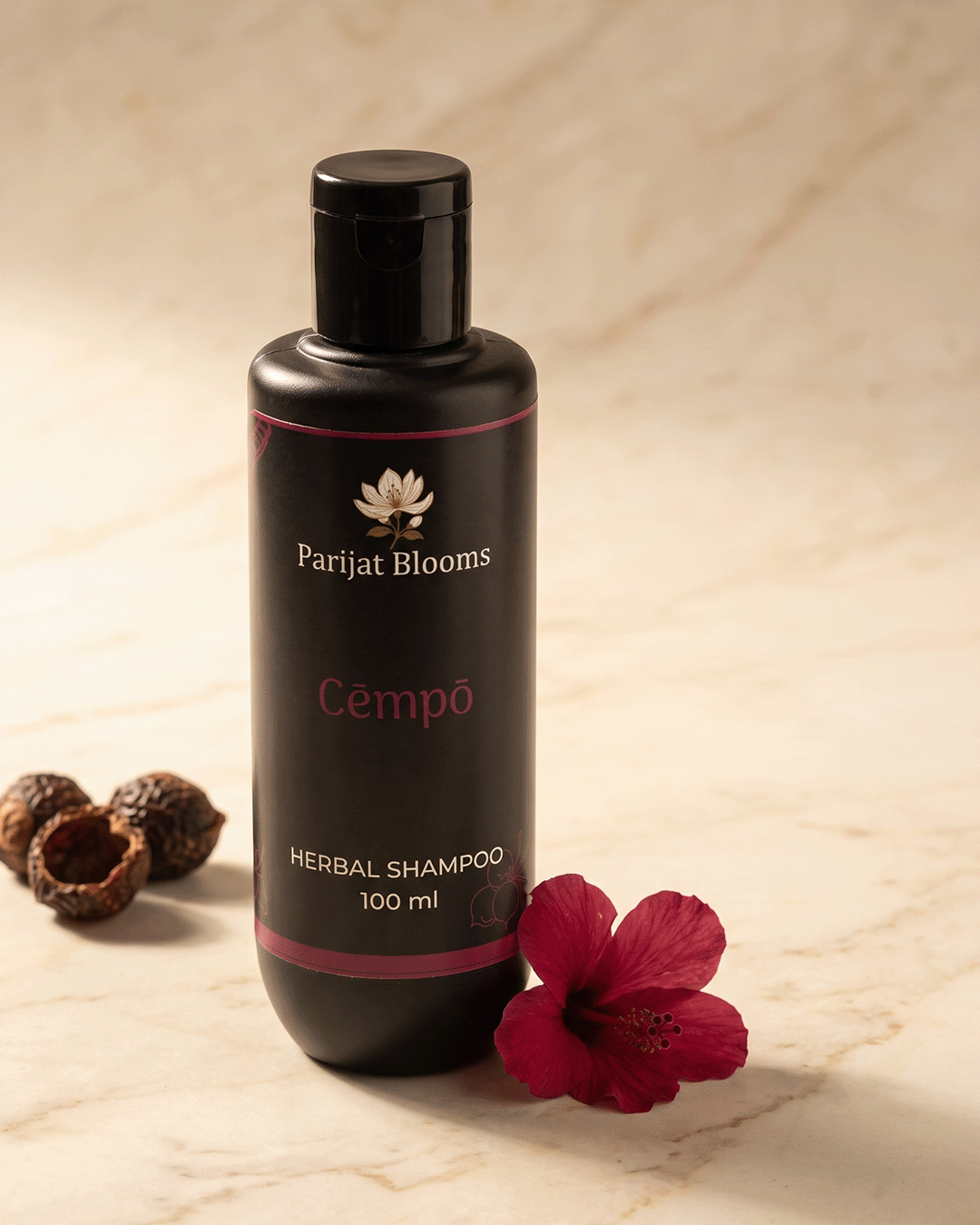 Cempo Herbal Shampoo premium still life with aritha shikakai hibiscus — luxury Ayurvedic shampoo by Parijat Blooms India